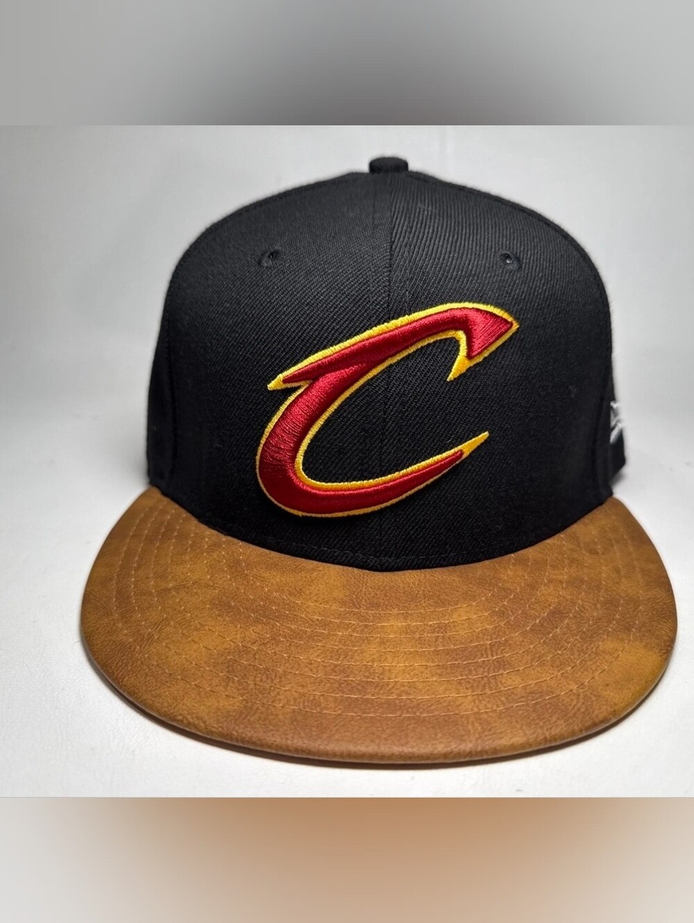 Cleveland Cavaliers Snapback Hat – Black Crown with Brown Faux-Leather Brim